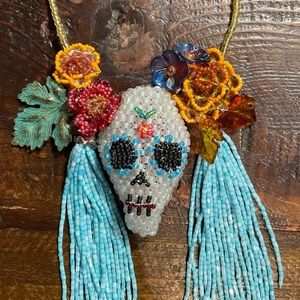 Hand crafted one of a kind day of the dead necklace Glass metal and resin beads.